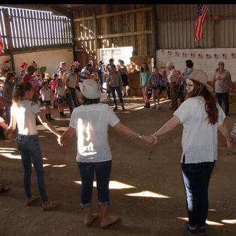 Dancers in a circle at a Hoedown
